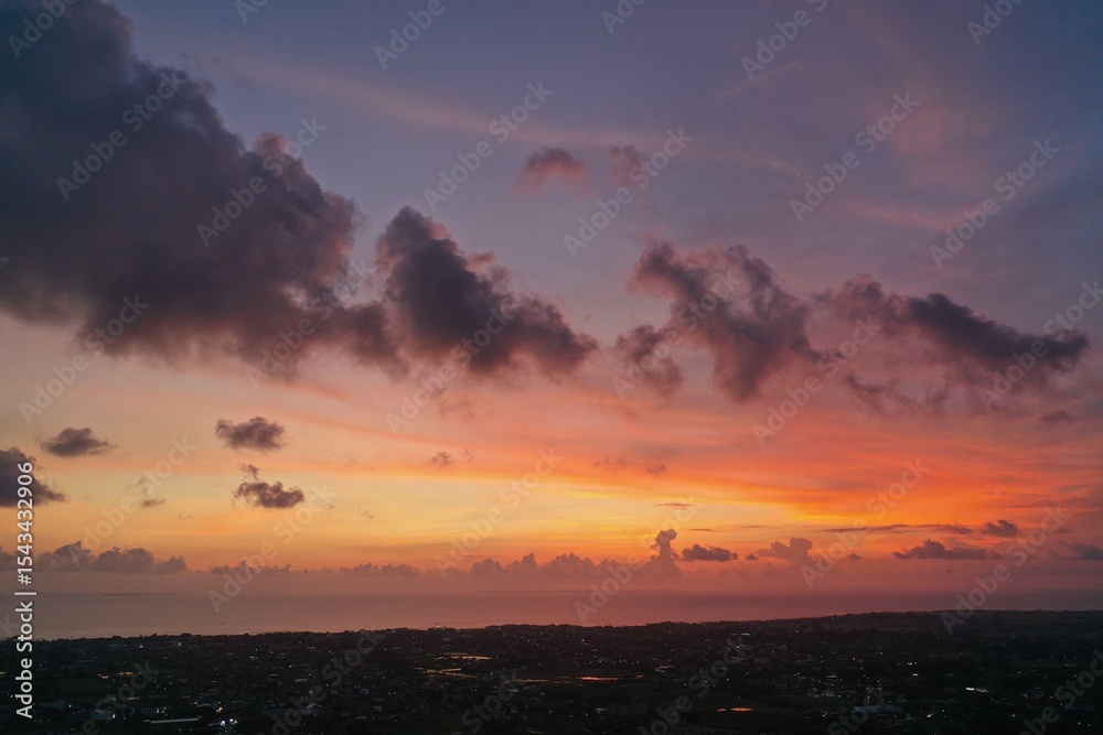 Fototapeta premium Fiery Sunset Sky Over Canggu — Aerial Drone View, Bali