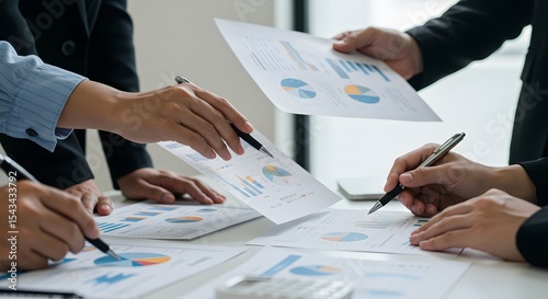 Hands of Colleagues Analyzing Business Reports
