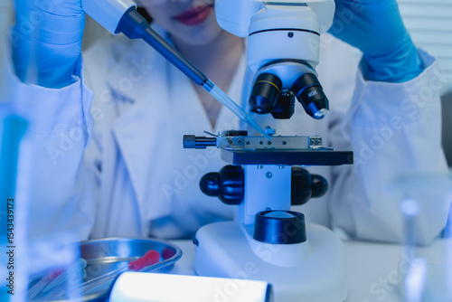 two scientists are working together to find a new antiviral drug, two chemists are using scientific tools to study science, microscope, working in the lab, researchers' work in the laboratory