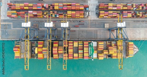 Top view Logistics and transportation of Container Cargo ship and Cargo plane with working crane bridge in shipyard at sunrise, logistic import export and transport industry background