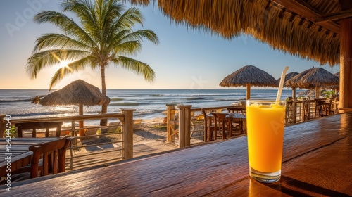 Relaxing Beachfront View with Tropical Drink and Beautiful Sunset