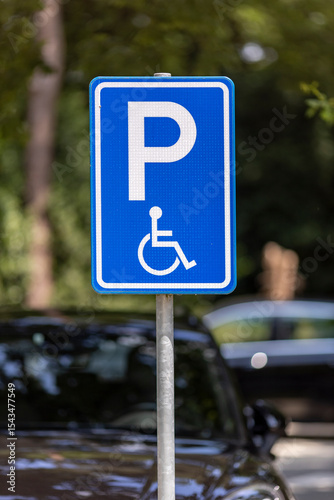 Dutch traffic sign denoting parking spot reserved for people with disabilities and handicapped restricted mobility