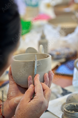 Shape clay with hands