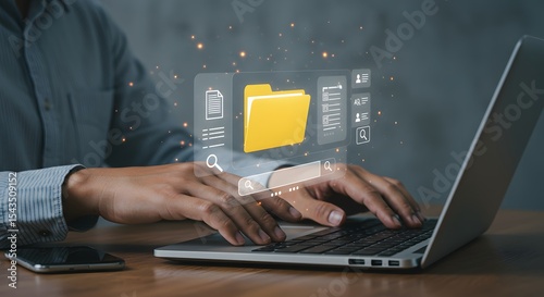 Person searching for files online using laptop computer