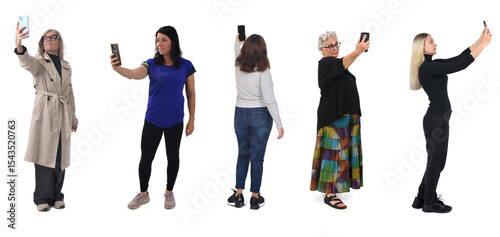 group of women taking a self-portrait with smartphone on white background