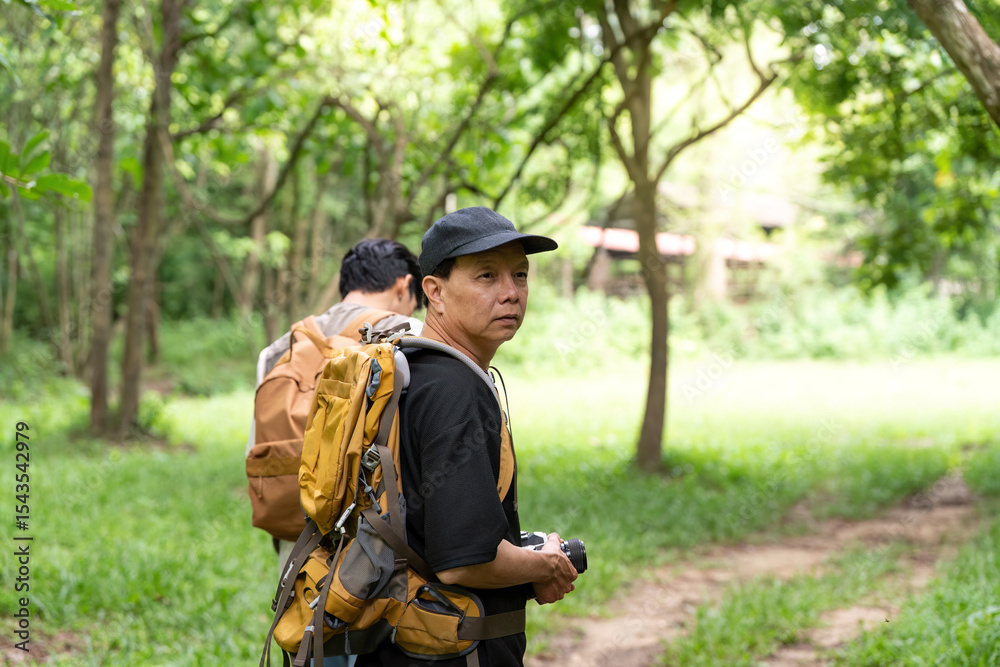 Fototapeta premium Father and Son Hiking Together: Capturing Nature