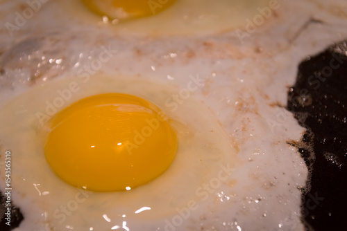 Eggs cooking in the frying pan for a good breakfast
