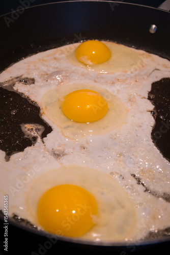Eggs cooking in the frying pan for a good breakfast