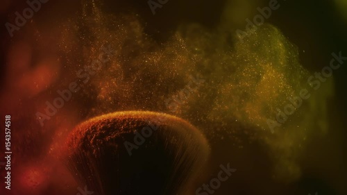 Super slow motion macro shot of woman finger touching makeup brush and making particles. Golden face powder shake at 1000 fps. Beauty make-up glitter flying in high speed. Close up luxury background