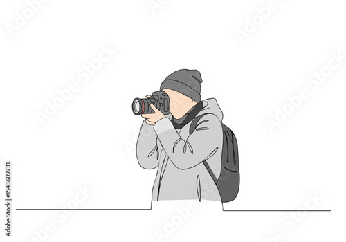 A photographer captures a landscape with a DSLR camera.  Stylish, outdoors, focused shot.  Great for travel, nature, and photography themes.