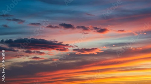 Sunset Sky Symphony: A breathtaking display of nature's artistry unfolds, with clouds painted in vibrant hues of orange, red, and blue.