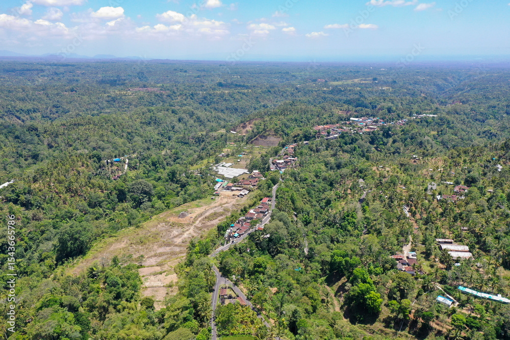 Obraz premium Panoramic Drone View of Forested Hills in Northern Bali