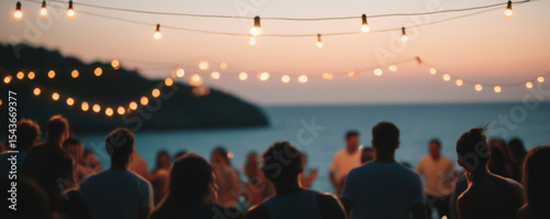 Lively ocean party at dusk with glowing string lights illuminating scene, creating festive atmosphere. People gather, enjoying beautiful sunset and vibrant energy