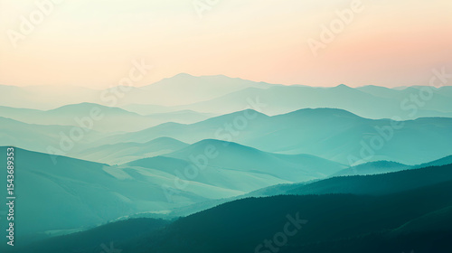 Layered Mountain Range View at Misty Sunrise with Serene Atmosphere