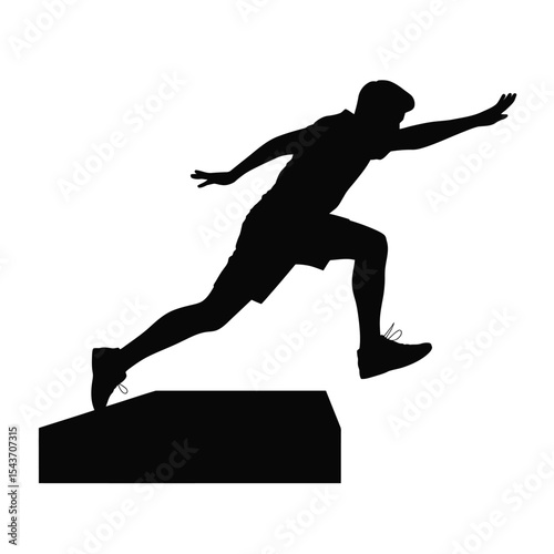 Silhouette of a man jumping over an obstacle