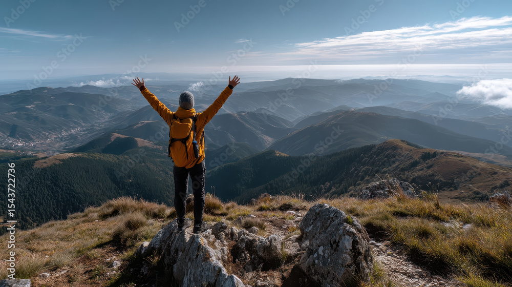 Hiker Reaching Summit with Arms Raised Celebrates Rear View of Expansive Mountain Landscape at Sunrise Hiker Reaching Summit with Arms Raised Celebrates Rear View of Expansive Mountain Landscape at Sunrise