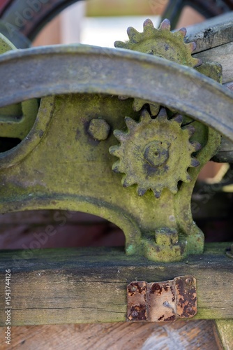 Foto Poland; old agricultural rusty machine - Chaff cutter, fragment part