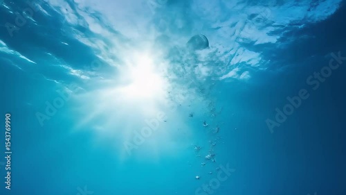 Underwater Bubbles Ascending Towards Sunlight, Blue Ocean, Serene Scene