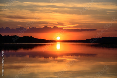 Beautiful, colorful sunset on the river.  Landscape with evening panorama view.
