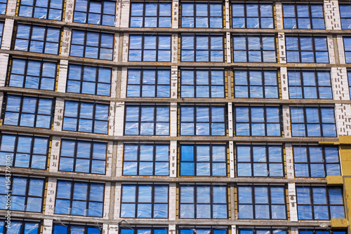 A new building with many windows is under construction