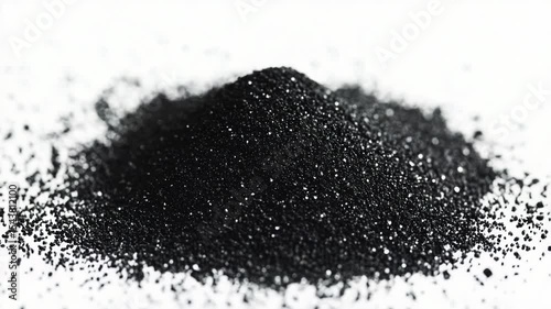 A pile of black powder sits on a white surface, awaiting use or reaction