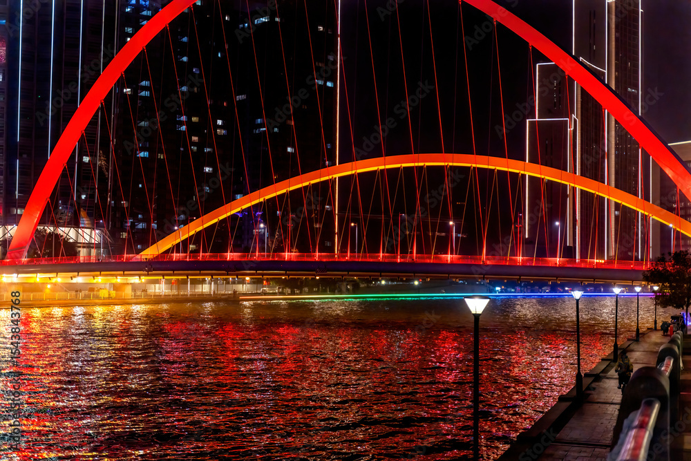 Obraz premium Tianjin World Financial Center, Dagu Bridge, old buildings and Illuminated Hai River, Tianjin, China. Built in 2005. Pedestrian walkway.