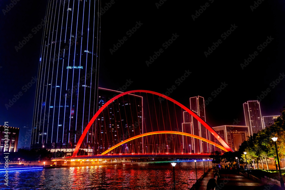 Fototapeta premium Tianjin World Financial Center, Dagu Bridge, old buildings and Illuminated Hai River, Tianjin, China. Built in 2005. Pedestrian walkway.