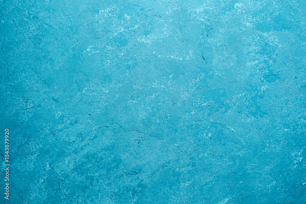 Naklejka premium Blue wall with rough plaster texture and mottled grunge surface