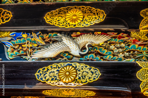 Colorful ornate wooden carving, Karamon Gate, Nijo Castle, Kyoto, Japan. Completed in 1626 by Tokugawa Shoguns. Chrysanthemum is a symbol of Imperial Court. photo