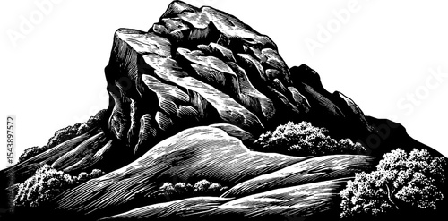 Rugged rocky outcrop against hillside with striking black and white contrast