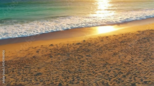 Golden Sunset Beach Scene Waves, Sand, and Tranquil Ocean at Dawn