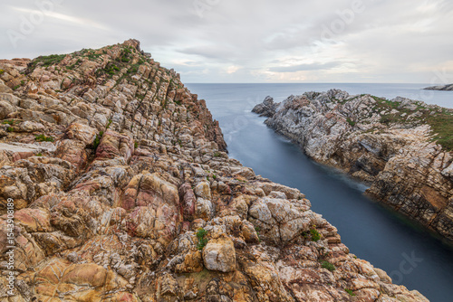 Spain, Mirador de Atalaya. Rock formations on ocean shore.