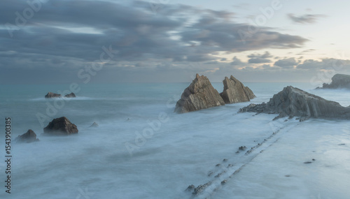 Spain, Liencres. Ocean seascape and sea stack formations.