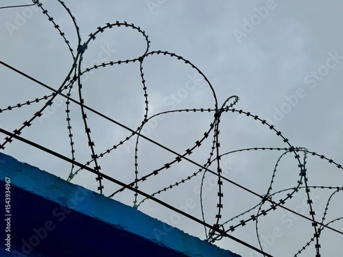 metal wire, fence on the background of the sky. High quality photo