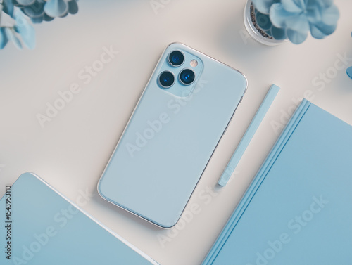 Top View of Blue Smartphone and Desk Accessories