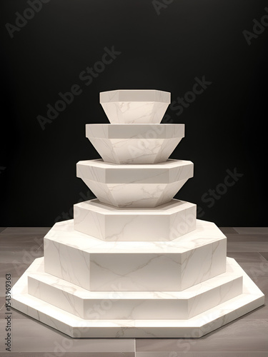 A hexagonal multi tiered podium with each tier perfectly symmetrical featuring a modern marble like finish. Sleek platform with stone top.
