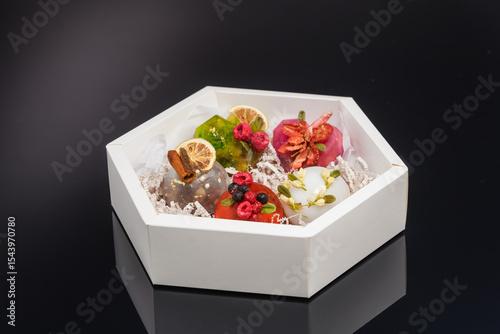 fruit berry tea in transparent balls and heart.