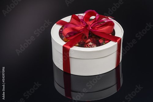 fruit berry tea in transparent balls and heart.