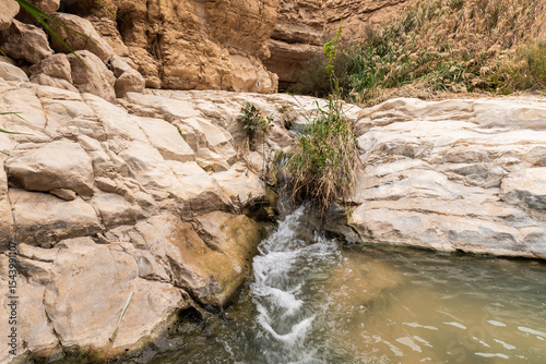 Small  waterfall downstream in the Arugot mountain Stream Nature Reserve near Dead Sea in southern Israel