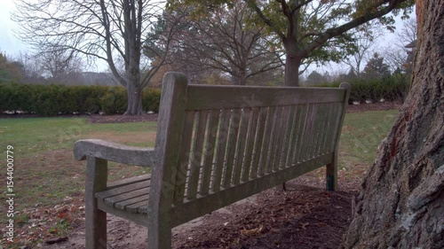 Empty park bench tilt up to sky dreaming 4k
