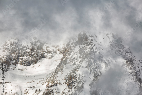 USA, Wyoming, Jackson. Grand Teton National Park, Sunlight illuminates mounta...