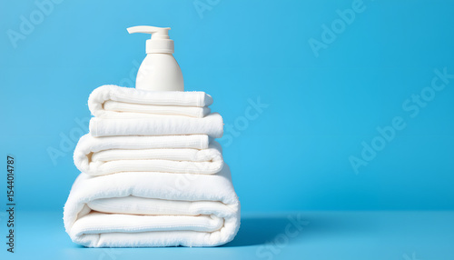 neat pile of fresh white towels and a soap bottle on a vibrant blue backdrop, pop-art. isolated with white highlights