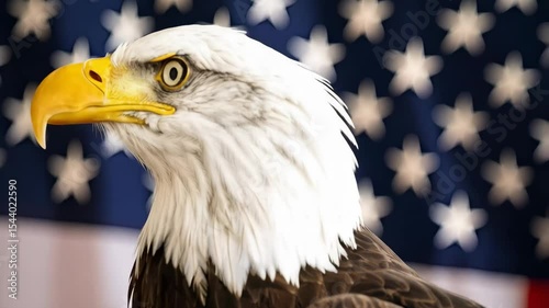 Detailed close up of a Bald Eagle in front of a flag with blurred stars and stripes, symbolizing freedom and patriotism
