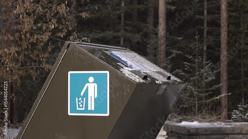 Throwing away trash into bin on nature trail 4k

