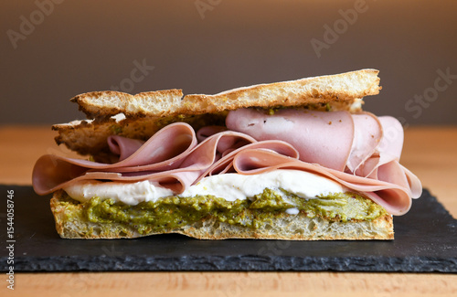 focaccia sandwich with mortadella, burrata and pesto