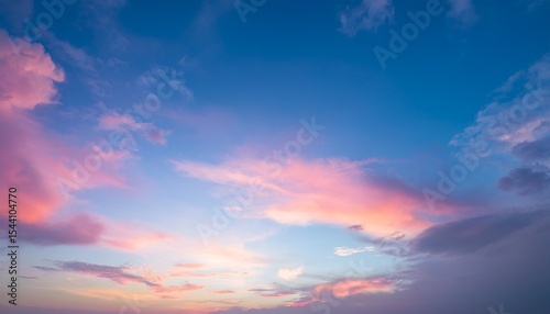 sky in the pink and blue colors effect of light pastel colored of sunset clouds cloud on the sunset sky background with a pastel color