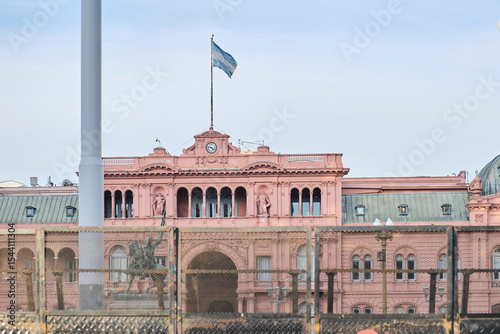 Casa Rosada, Pink House, headquarters of the national executive branch, behind a protective fence; Plaza de Mayo, Buenos Aires, Argentina.
