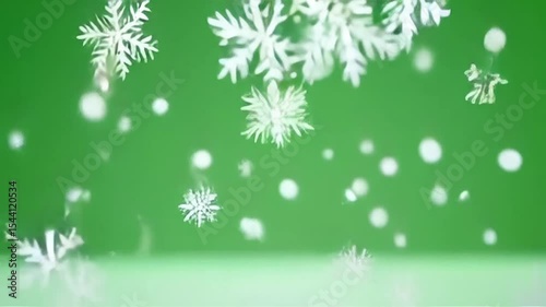 Snowflakes Falling Slowly on Green Background Winter Scene