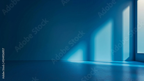 Blue wall with dramatic shadows from window light in minimal space