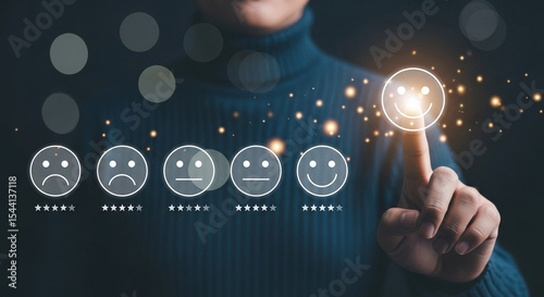 Person selecting a happy face on a customer satisfaction survey with glowing particles around it